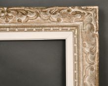 An early 20th century carved wood frame, rebate size 14