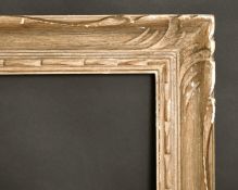 A 20th century carved wood frame, 19.75