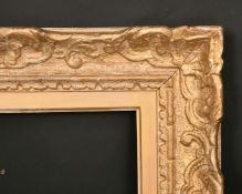 An early 20th century carved wood frame, rebate size 10.5