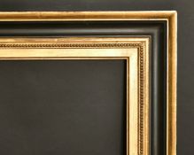 An ebonised and gilt frame, rebate size, 24
