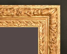 A gilt composition frame with trailing foliage, rebate size, 14.25
