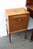 A mahogany cellarette on stand.