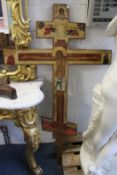 A large decorative gilded and painted Russian Orthodox Crucifix.
