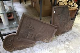 A cast iron fireback (in two parts).