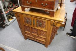 A Chinese altar cabinet.