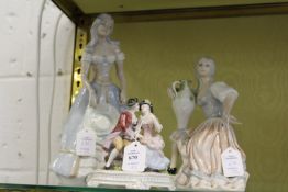 A continental porcelain group of two young lovers together with two Lladro style figures.