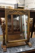 An oak dressing table mirror.