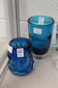 A Whitefriars peacock blue optic vase and another blue vase.