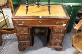 A good reproduction mahogany kneeholde desk.