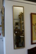 A gilt framed dressing mirror.