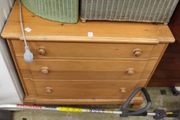 A pine three drawer chest.