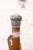 A Malacca walking stick with silver top.