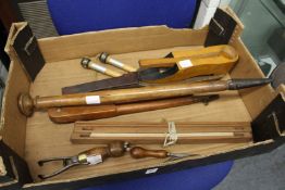 Early bygones to include an electric light bulb remover, carpet stretcher, a bat and trap game