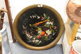 A large circular Toleware tray painted with exotic birds and fruit.