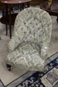 A Victorian small button upholstered armchair.