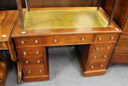 A small mahogany twin pedestal desk.
