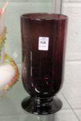 An amethyst coloured pedestal vase with bubble decoration.