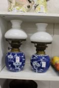 Two Chinese prunus pattern ginger jars converted to lamps.