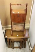 A nest of oak tables and a sewing box.