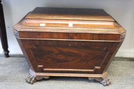 A 19th century mahogany sarcophagus form cellarette.