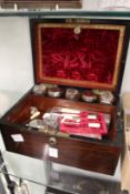 A ladies' Victorian rosewood vanity case with various contents.