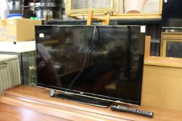 A JVC flat screen TV.
