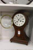 An Edwardian inlaid mahogany balloon shaped mantle clock.