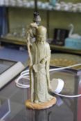 A Chinese carved soapstone figure of Lohan, mounted as a table lamp.