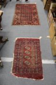 Two old Persian rugs, worn.