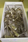 A large collection of sugar tongs.