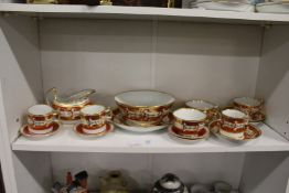 A small group of Flight Barr and Barr china, orange brown with gilded decoration.