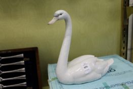 A Lladro model of a swan complete with original box.