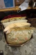 A box of assorted cushions.
