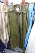 A ladies' green leather full length coat.