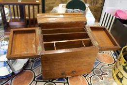 An oak table top stationery box, with folding top and draw.