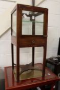 A mahogany display cabinet (as found).