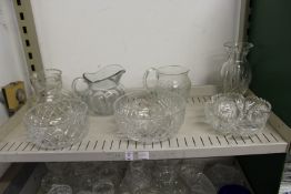 Cut glass items to include jugs, bowls and a vase.