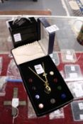 Three items of jewellery, boxed.