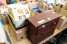 A quantity of postcards and books.