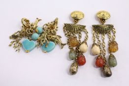 Two pairs of decorative earrings.