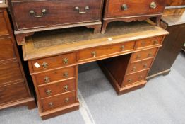 A Victorian Gothic revival walnut twin pedestal desk.