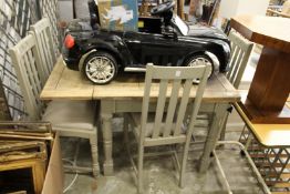 A part painted oak draw leaf dining table and four chairs.