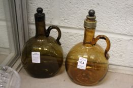 Two amber coloured liqueur bottles.