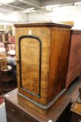 A Victorian figured walnut pot cupboard.