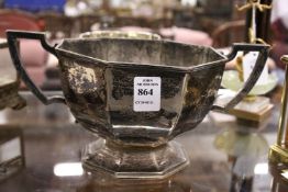 A silver trophy style twin handled pedestal bowl.