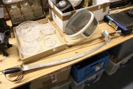 A sabre, a fencing foil and fencing mask.
