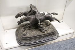 A cast spelter group of two jockeys on horseback (AF).