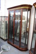 A good large mahogany two door display cabinet with bowed ends.