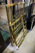 A brass single bed frame.