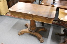 A 19th century rosewood D-shaped fold over card table.